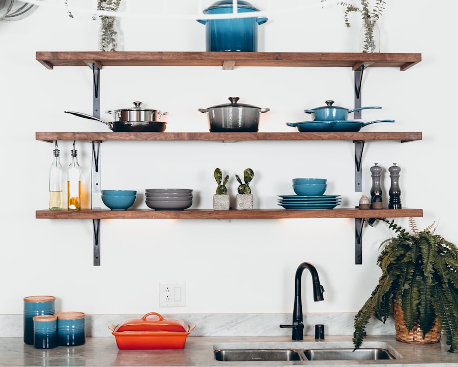 Kitchen shelves lined with pots, kadhai and cookware