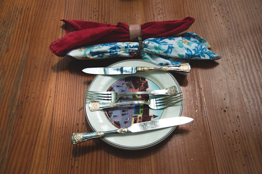 Silver cutlery set with fork and knives laid on a plate